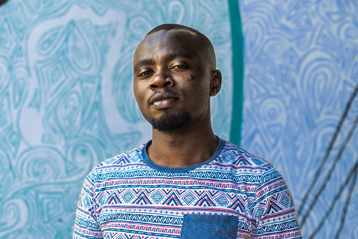 Portrait of a man in a t-shirt with a pattern