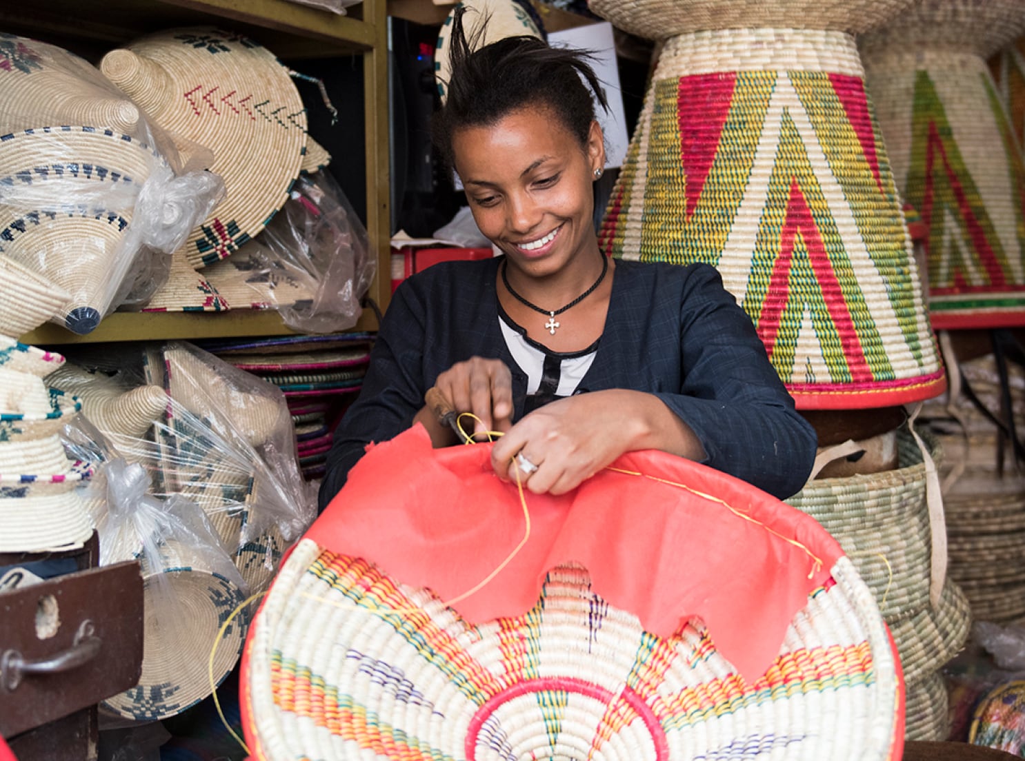 Smiling woman sewing