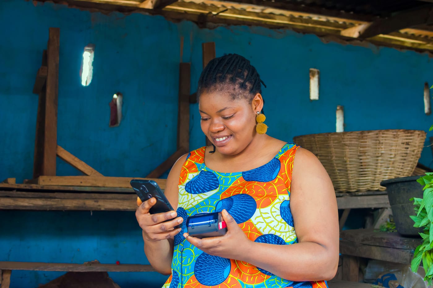 Woman in a colorful dress checking her phone