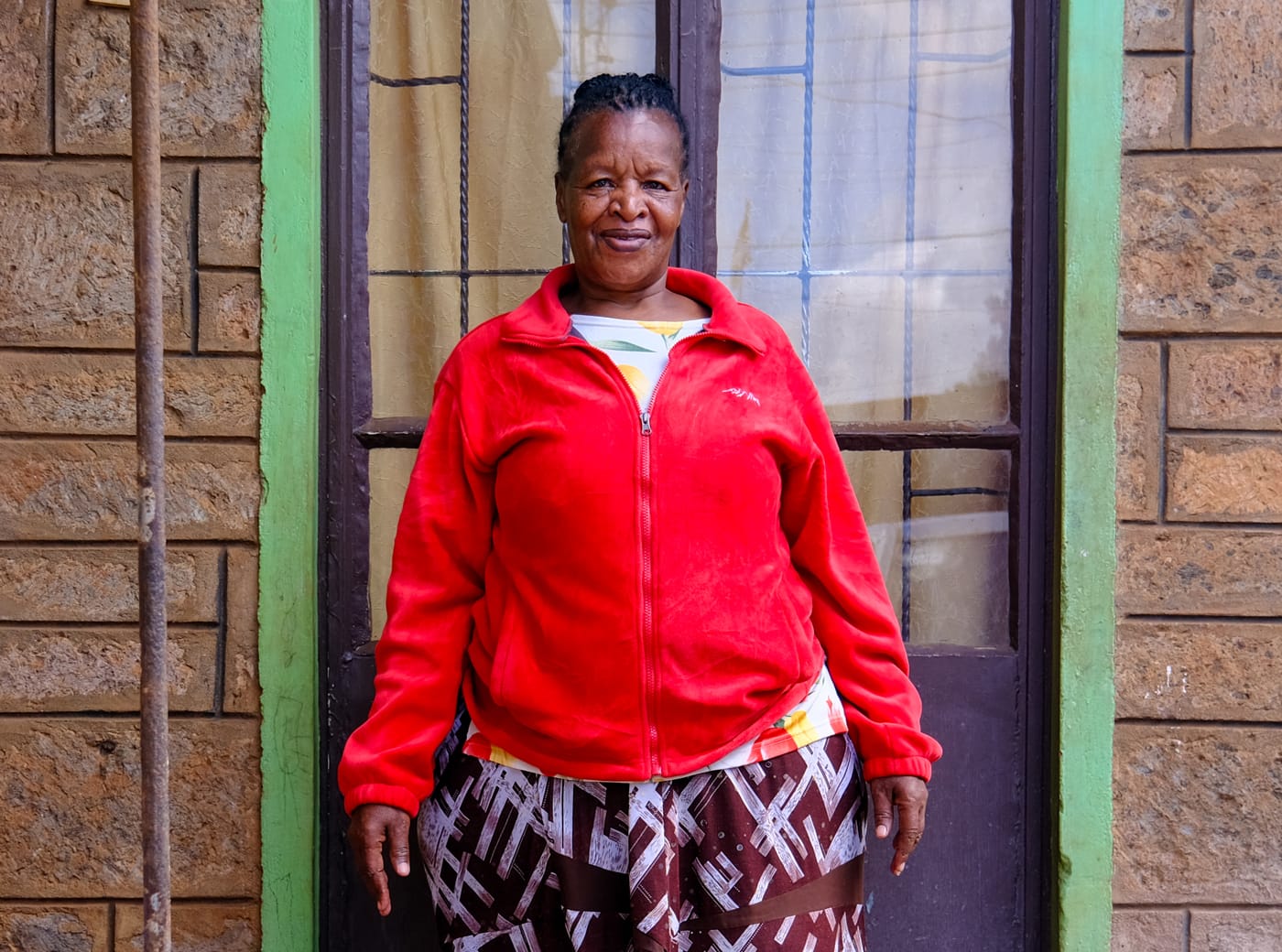 Woman standing in front of a glass door